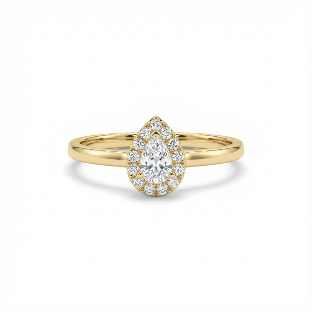 Yellow gold pear-shaped diamond halo ring on a white background