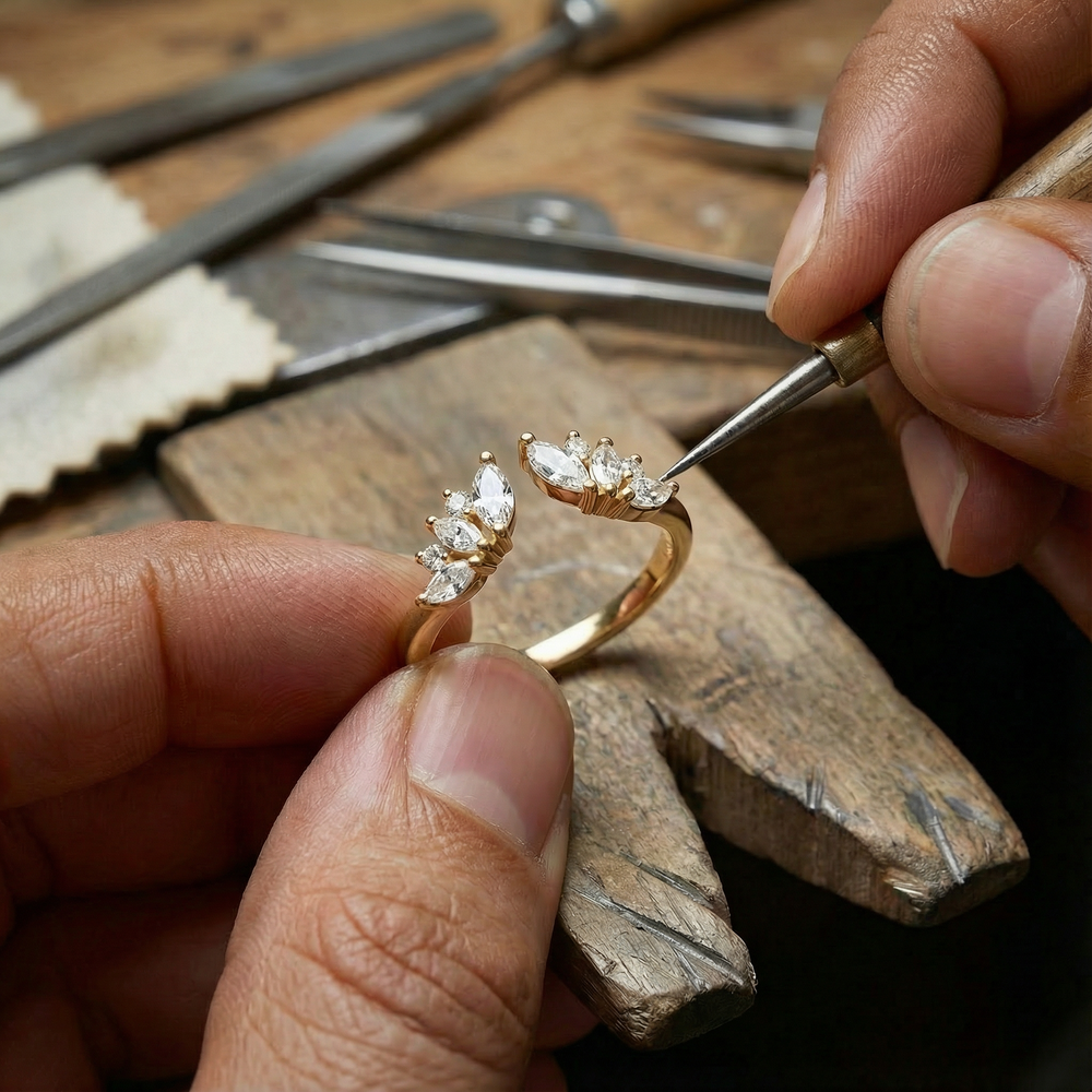 Jeweler setting diamonds into a gold ring with a precision tool