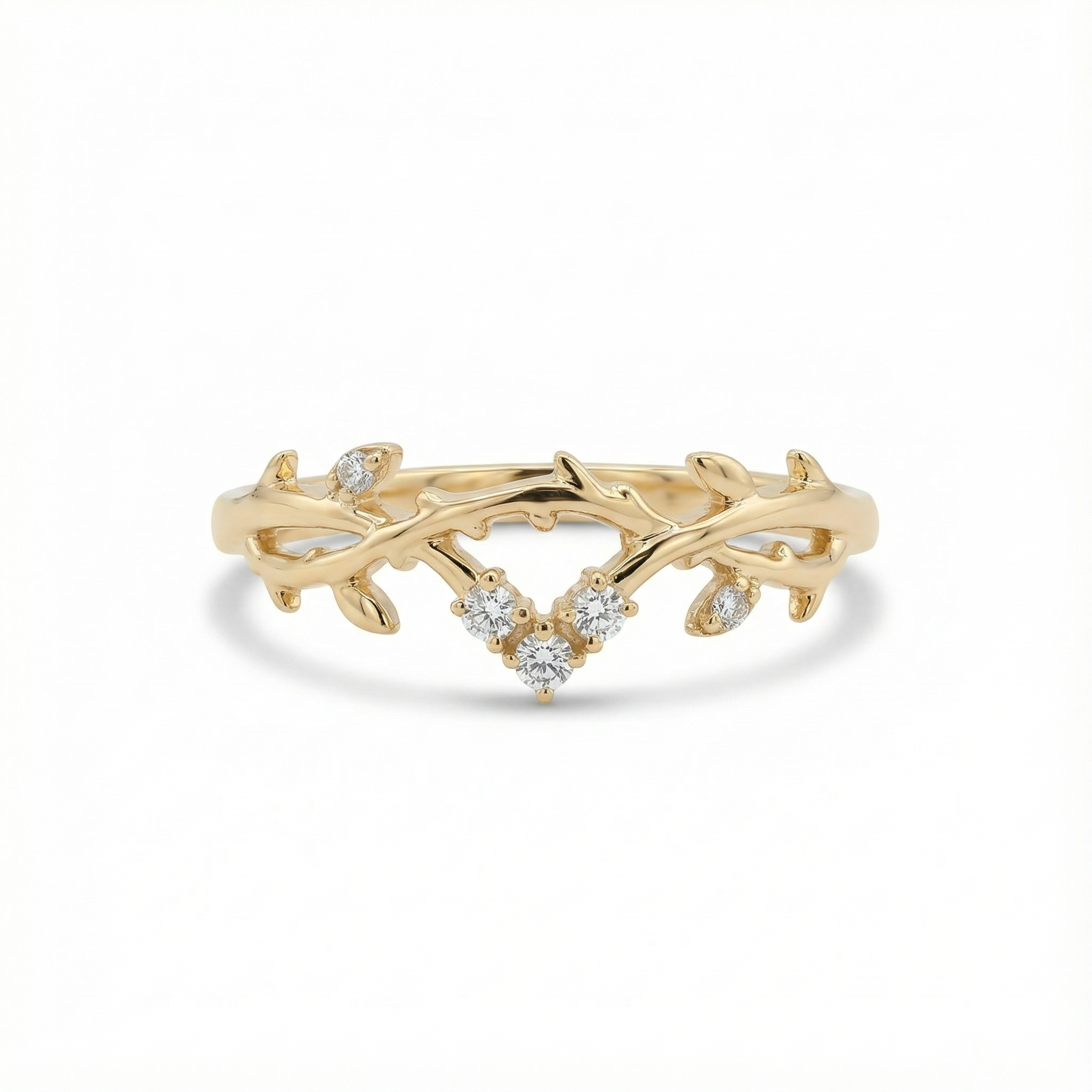 Gold ring with marquise-cut diamonds on a white background